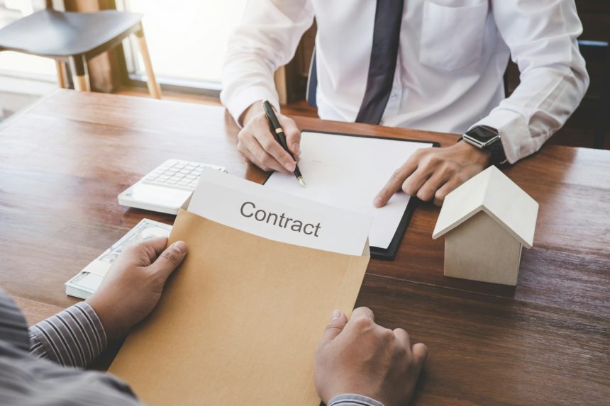 Business Signing a Contract Buy - sell house