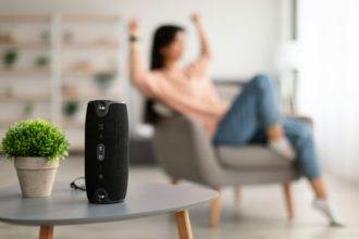 Closeup of smart portable wireless speaker on the table