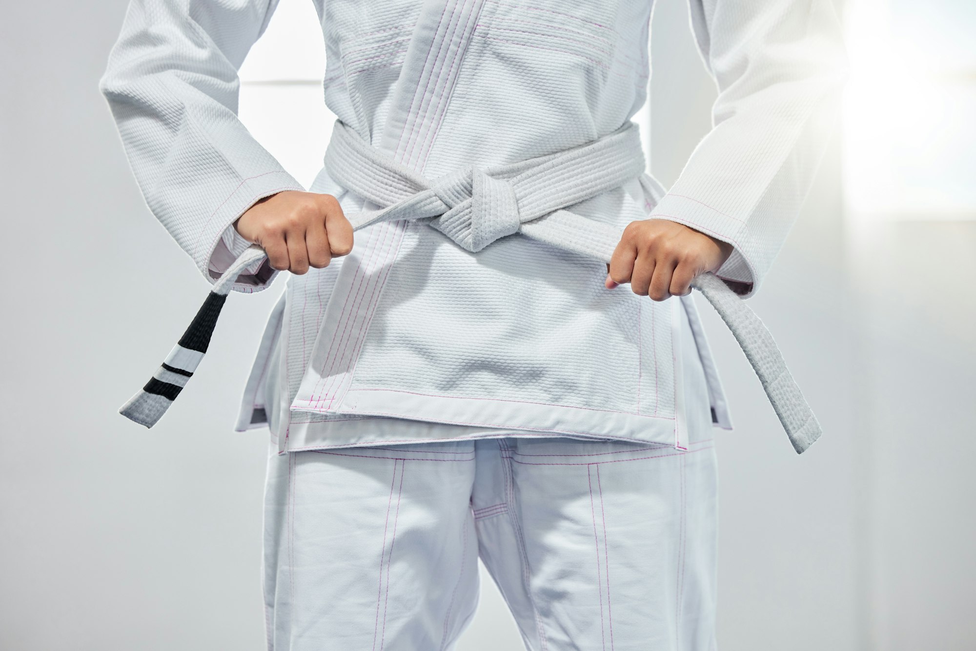 karate belt, martial arts and woman ready for fight battle, white dojo training or fitness challeng