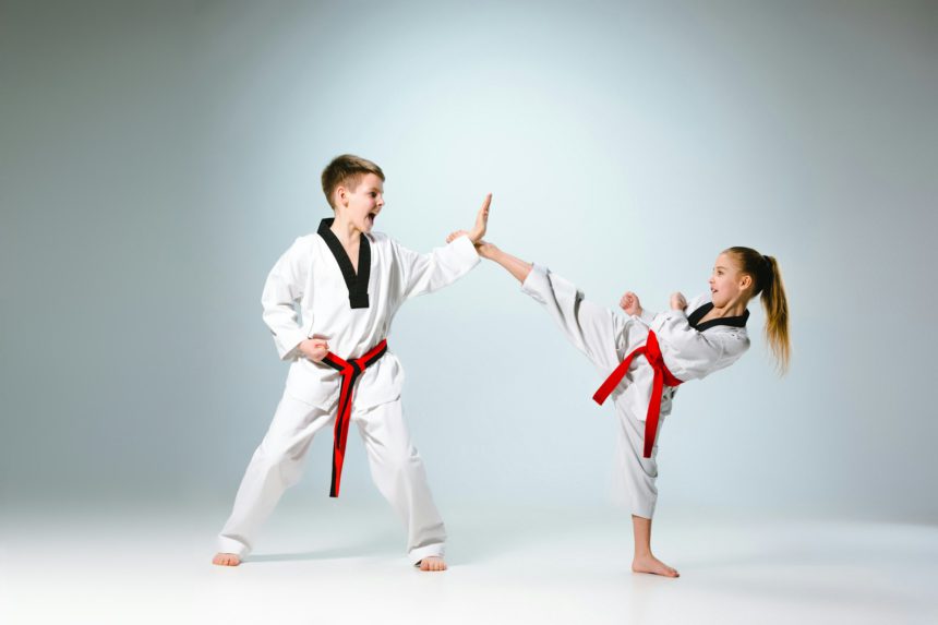 The studio shot of group of kids training karate martial arts