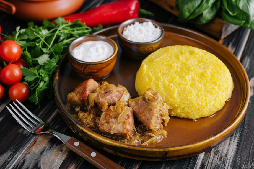 Traditional Moldavian, Romanian cornmeal porridge with meat and sauce